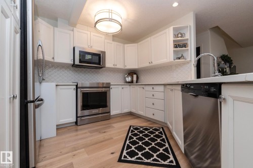#304 14 Mission Av, St. Albert, AB - Indoor Photo Showing Kitchen With Stainless Steel Kitchen