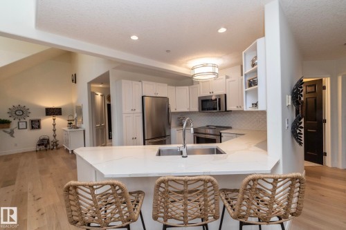 #304 14 Mission Av, St. Albert, AB - Indoor Photo Showing Kitchen With Stainless Steel Kitchen With Upgraded Kitchen