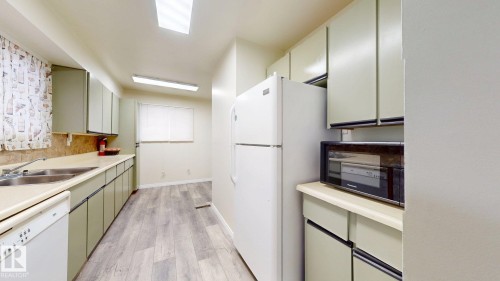 #45 4403 Riverbend Rd Nw, Edmonton, AB - Indoor Photo Showing Kitchen With Double Sink