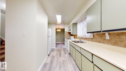 #45 4403 Riverbend Rd Nw, Edmonton, AB - Indoor Photo Showing Kitchen With Double Sink