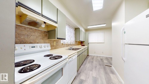 #45 4403 Riverbend Rd Nw, Edmonton, AB - Indoor Photo Showing Kitchen With Double Sink