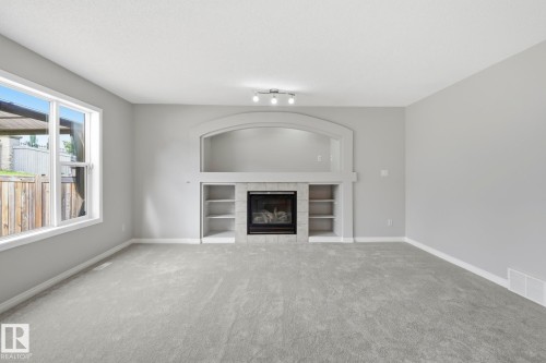 10719 8 Avenue Sw, Edmonton, AB - Indoor Photo Showing Living Room With Fireplace