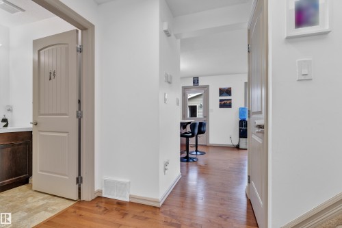 Warm wood-finish flooring provides a welcoming entry - 7223 19A Avenue Sw, Edmonton, AB - Indoor