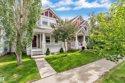 Craftsman-style exterior with gabled roof accents and a covered front porch - 7223 19A Avenue Sw, Edmonton, AB - Outdoor With Deck Patio Veranda With Facade