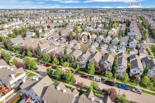 Aerial perspective showcasing a residential neighborhood with numerous detached homes featuring pitched roofs and varied architectural styles - 7223 19A Avenue Sw, Edmonton, AB - Outdoor With View