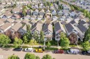 Residential property featuring a light-colored exterior with a prominent bay window and an attached front porch - 7223 19A Avenue Sw, Edmonton, AB  - Outdoor With View 