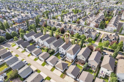 Aerial perspective showcasing a residential neighborhood with numerous detached homes, each featuring dark shingle roofing - 7223 19A Avenue Sw, Edmonton, AB - Outdoor With View