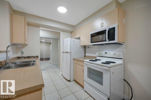 #122 17011 67 Av Nw, Edmonton, AB - Indoor Photo Showing Kitchen With Double Sink