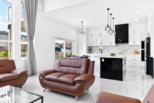 Open-concept living area with white tile flooring and high ceilings - 3926 41 Avenue, Beaumont, AB - Indoor Photo Showing Other Room
