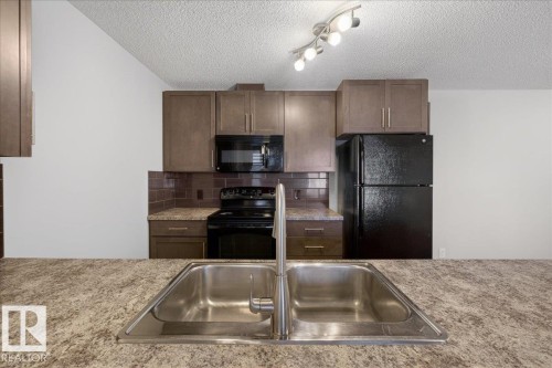 #123 6084 Stanton Dr Sw, Edmonton, AB - Indoor Photo Showing Kitchen With Double Sink