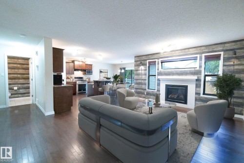 632 60 Street Sw, Edmonton, AB - Indoor Photo Showing Living Room With Fireplace