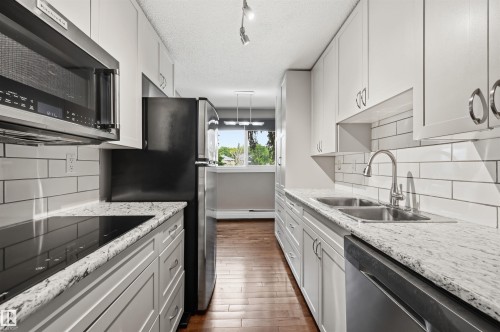 #201 9725 82 Av Nw, Edmonton, AB - Indoor Photo Showing Kitchen With Double Sink With Upgraded Kitchen