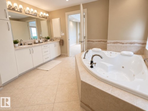 Soaking tub with integrated jets - #1201 10035 Saskatchewan Dr Nw, Edmonton, AB - Indoor Photo Showing Bathroom