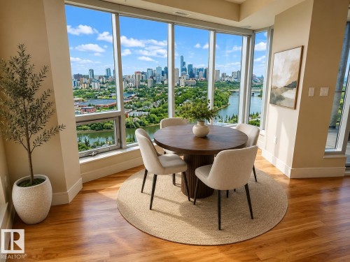 Floor-to-ceiling windows with expansive city and river scenery - #1201 10035 Saskatchewan Dr Nw, Edmonton, AB - Indoor Photo Showing Dining Room