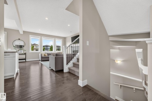 Wood-finish flooring throughout the main level - 1323 158 Street Sw, Edmonton, AB - Indoor