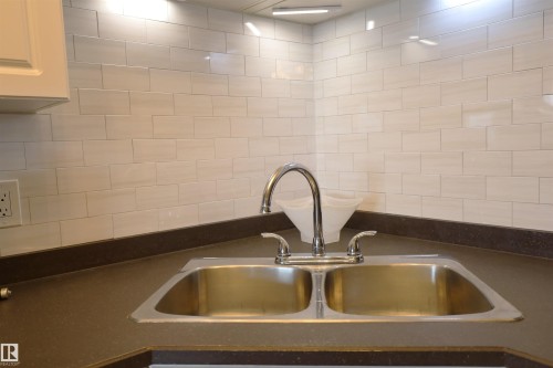 #415 12550 140 Av Nw, Edmonton, AB - Indoor Photo Showing Kitchen With Double Sink