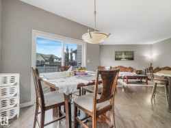 Hardwood-finish flooring throughout, vaulted ceiling, large picture window, and recessed lighting - 