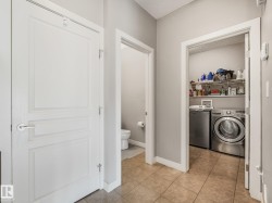 Tile flooring, neutral wall colors, and white trim - 
