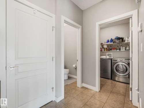 Tile flooring, neutral wall colors, and white trim - 1478 37B Avenue Nw, Edmonton, AB - Indoor Photo Showing Laundry Room