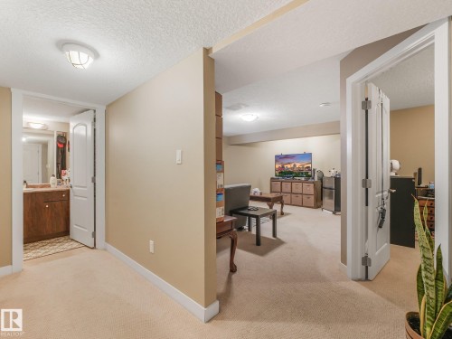 Carpeted flooring throughout, recessed lighting, and a neutral wall color - 1478 37B Avenue Nw, Edmonton, AB - Indoor Photo Showing Other Room