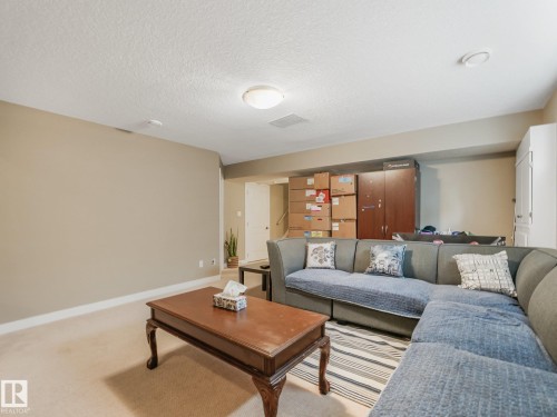 Recessed lighting and a flush mount light fixture illuminating the space - 1478 37B Avenue Nw, Edmonton, AB - Indoor Photo Showing Living Room
