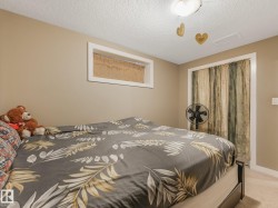 Recessed window with white trim, built-in ceiling light fixture, and neutral painted walls - 