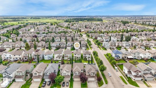 Residential neighborhood featuring detached homes and paved streets - 1478 37B Avenue Nw, Edmonton, AB - Outdoor With View