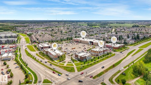 Neighborhood featuring commercial retail establishments, extensive paved roadways, and residential developments - 1478 37B Avenue Nw, Edmonton, AB - Outdoor With View