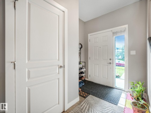 White paneled door with brushed nickel hardware - 1478 37B Avenue Nw, Edmonton, AB - Indoor Photo Showing Other Room