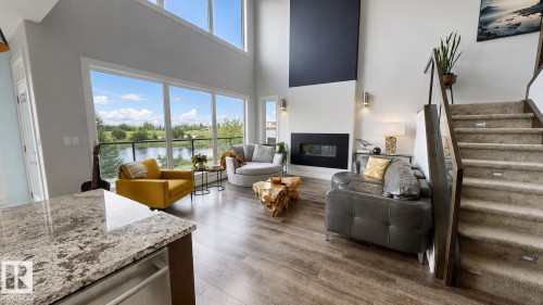80 Ellison Court, Fort Saskatchewan, AB - Indoor Photo Showing Living Room With Fireplace