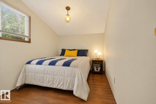 Sloped ceiling with recessed lighting - 264 Beach Avenue, Rural Barrhead County, AB - Indoor Photo Showing Bedroom