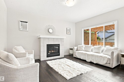 3741 Kidd Crescent Sw, Edmonton, AB - Indoor Photo Showing Living Room With Fireplace