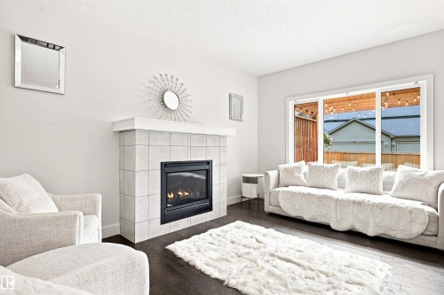 3741 Kidd Crescent Sw, Edmonton, AB - Indoor Photo Showing Living Room With Fireplace