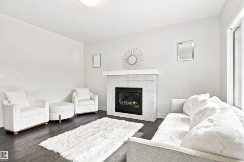 3741 Kidd Crescent Sw, Edmonton, AB - Indoor Photo Showing Living Room With Fireplace