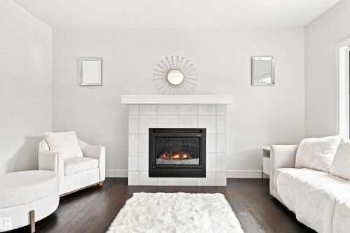 3741 Kidd Crescent Sw, Edmonton, AB - Indoor Photo Showing Living Room With Fireplace
