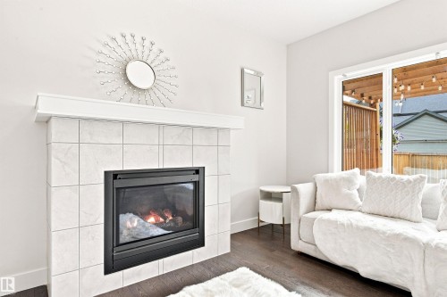 3741 Kidd Crescent Sw, Edmonton, AB - Indoor Photo Showing Living Room With Fireplace