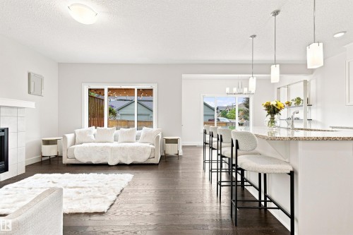 3741 Kidd Crescent Sw, Edmonton, AB - Indoor Photo Showing Living Room With Fireplace