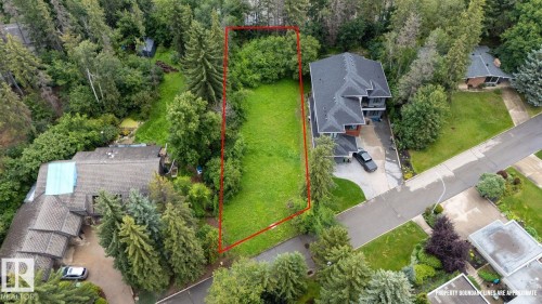 Expansive lot featuring a level, manicured lawn bordered by mature evergreen and deciduous trees - 2 Grandin Place, St. Albert, AB 