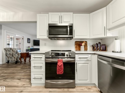 #211 9003 106A Av Nw, Edmonton, AB - Indoor Photo Showing Kitchen With Stainless Steel Kitchen
