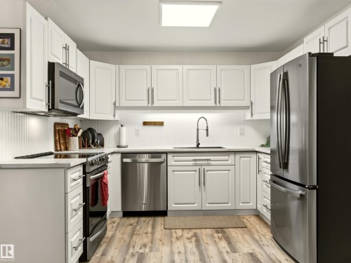 #211 9003 106A Av Nw, Edmonton, AB - Indoor Photo Showing Kitchen With Stainless Steel Kitchen With Upgraded Kitchen