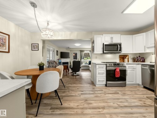 #211 9003 106A Av Nw, Edmonton, AB - Indoor Photo Showing Kitchen With Stainless Steel Kitchen