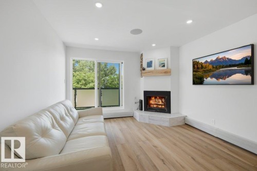 #6 4415 Lakeshore Dr, Sylvan Lake, AB - Indoor Photo Showing Living Room With Fireplace