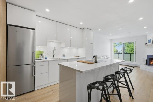 #6 4415 Lakeshore Dr, Sylvan Lake, AB - Indoor Photo Showing Kitchen With Stainless Steel Kitchen With Upgraded Kitchen