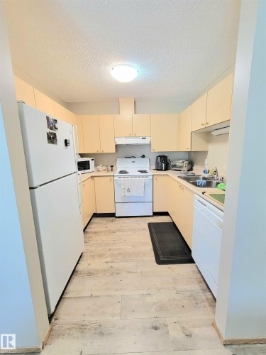 #108D 122 Westpark Dr, Fort Saskatchewan, AB - Indoor Photo Showing Kitchen With Double Sink