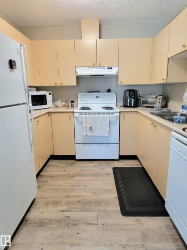 #108D 122 Westpark Dr, Fort Saskatchewan, AB - Indoor Photo Showing Kitchen With Double Sink
