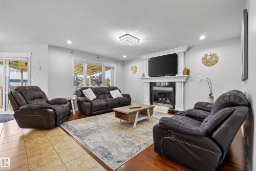 16604 59 Street Nw, Edmonton, AB - Indoor Photo Showing Living Room With Fireplace