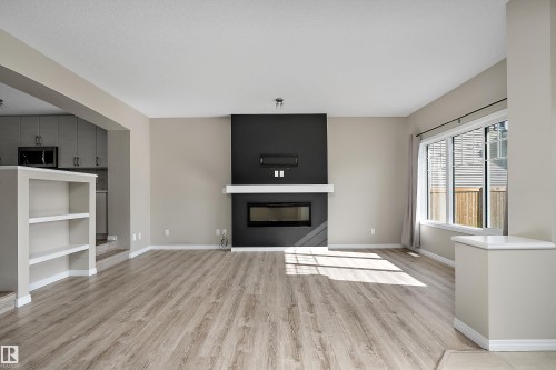 4037 Prowse Lane Sw, Edmonton, AB - Indoor Photo Showing Living Room With Fireplace