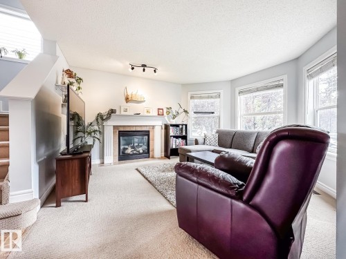 12060 19 Avenue Sw, Edmonton, AB - Indoor Photo Showing Living Room With Fireplace