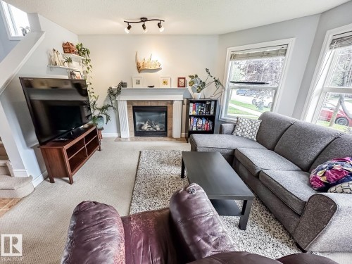 12060 19 Avenue Sw, Edmonton, AB - Indoor Photo Showing Living Room With Fireplace