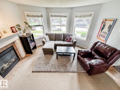 12060 19 Avenue Sw, Edmonton, AB - Indoor Photo Showing Living Room With Fireplace